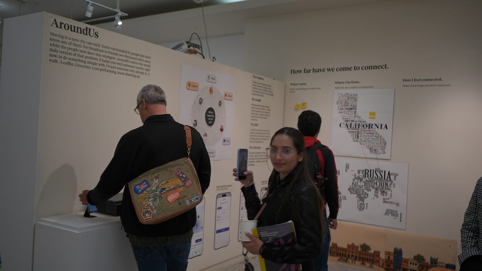 AroundUs exhibition photograph: questions at the wall.