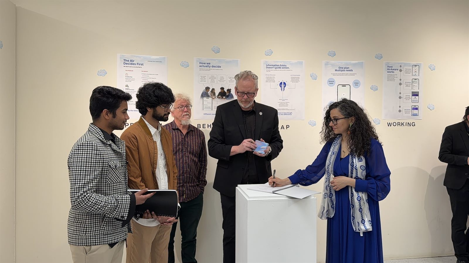 AroundUs exhibition photograph: a shared critique.