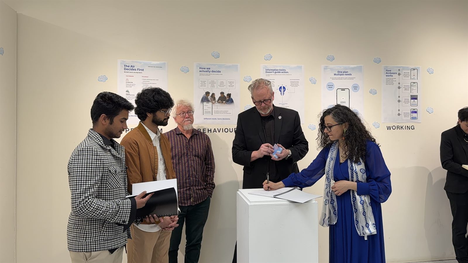 AroundUs exhibition photograph: explaining the interaction.